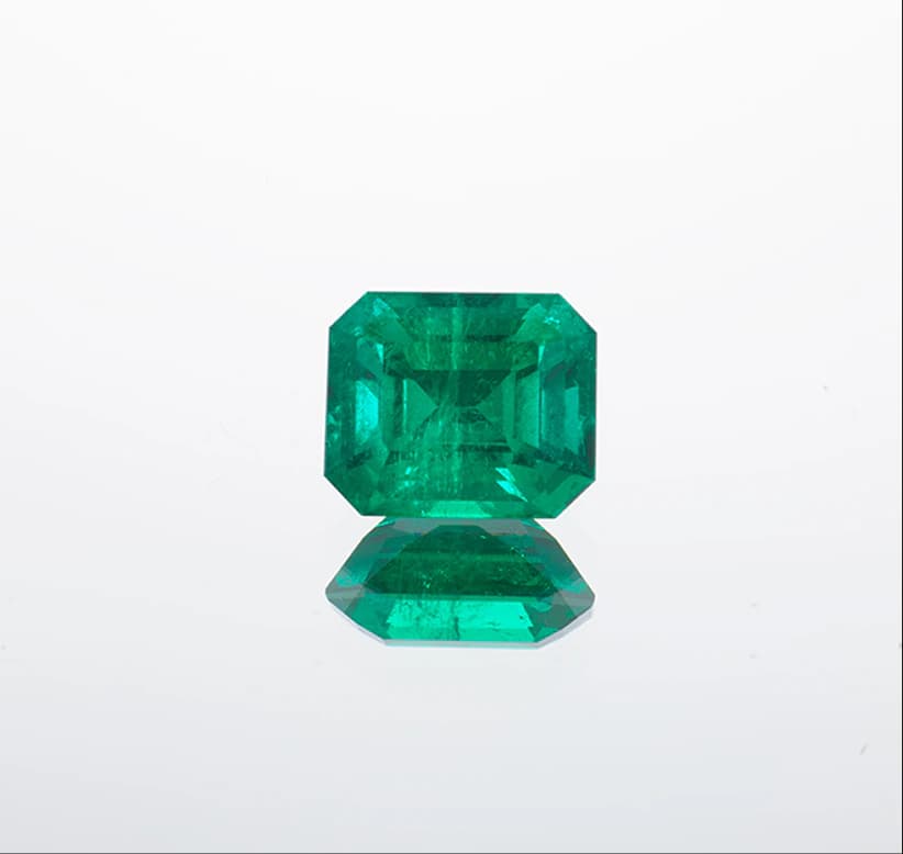 Emerald-cut emerald on dark background